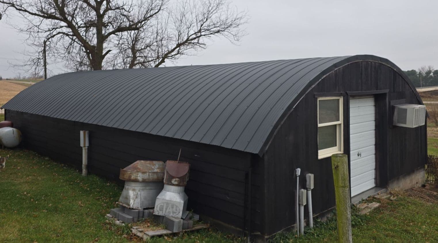 New Black Flex Metal Roof on Outdated Barrel Roof in Potosi WI
