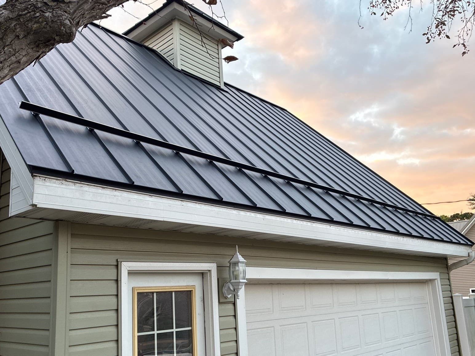 Gallery photos for Asphalt Shingles Out, Black Standing Seam Metal Roof In: Image #2