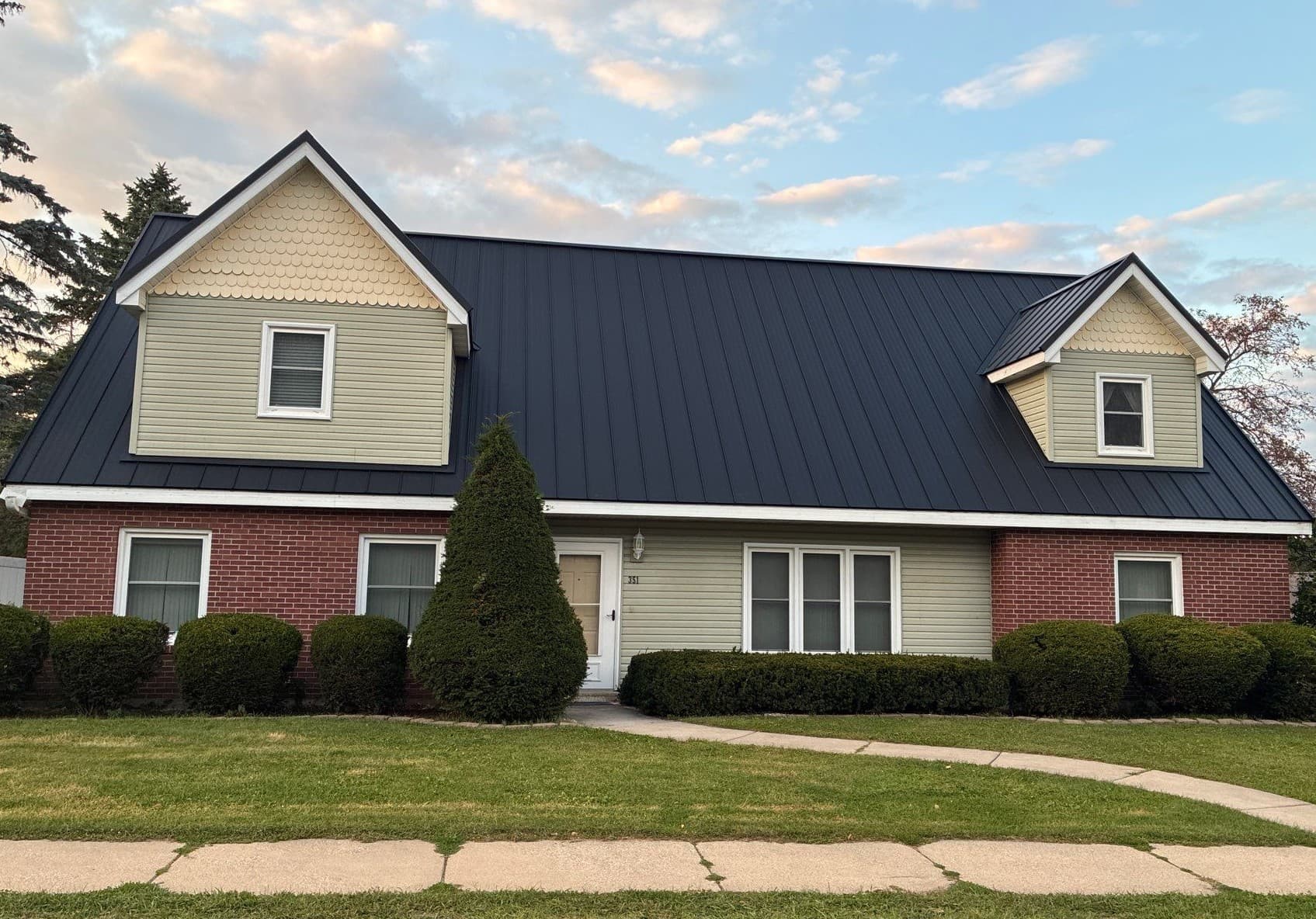 Gallery photos for Asphalt Shingles Out, Black Standing Seam Metal Roof In: Image #4