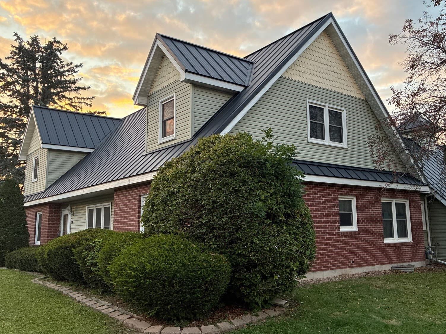 Gallery photos for Asphalt Shingles Out, Black Standing Seam Metal Roof In: Image #3